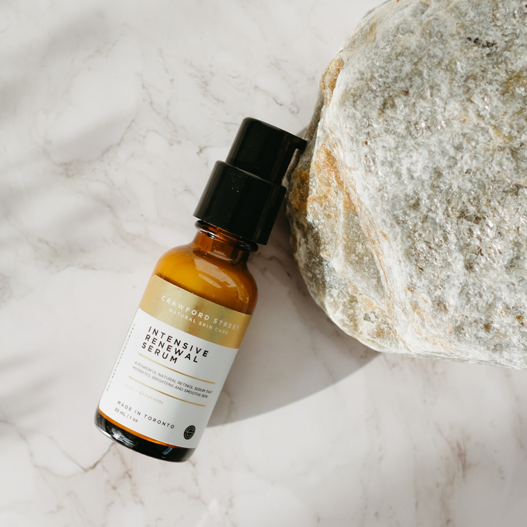 Crawford Street Intensive Renewal Serum glass bottle on a marble background